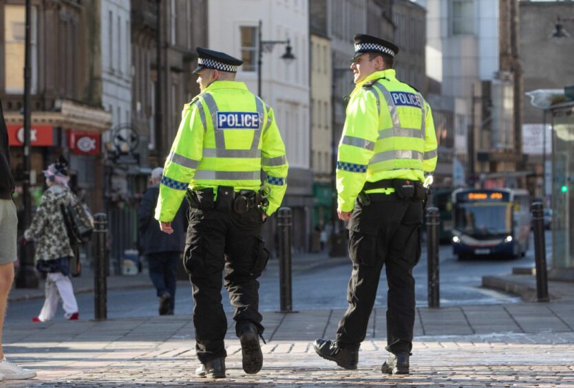 Archive image of two police officers patrolling Dundee city centre for our 2024 crime rate map. 