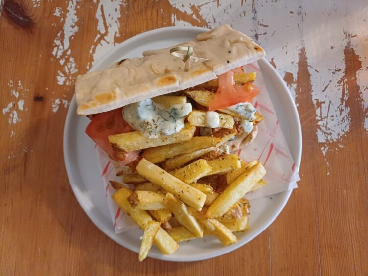 The tofu gyros from Nooch, served alongside a pile of thick-cut chips.