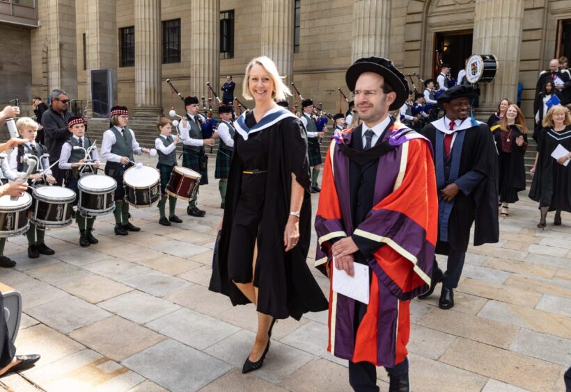 Dundee University graduates savour their moment in the sun. 