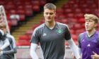 Alasdair Davidson warms up before a game with Celtic youths.