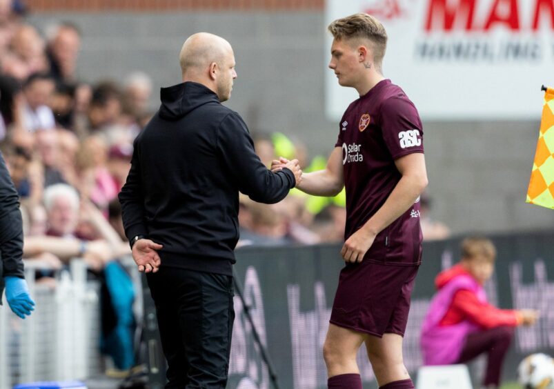 Ethan Drysdale shakes hands with then Hearts boss Steven Naismith.
