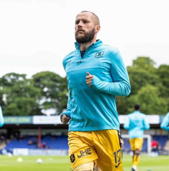 Stevie May warms up for Livingston.
