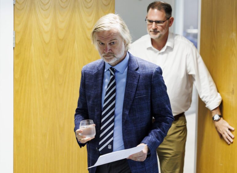 Dundee FC's Steven Pressley and John Nelms enter the room at Gardyne. Image: Mark Scates/SNS