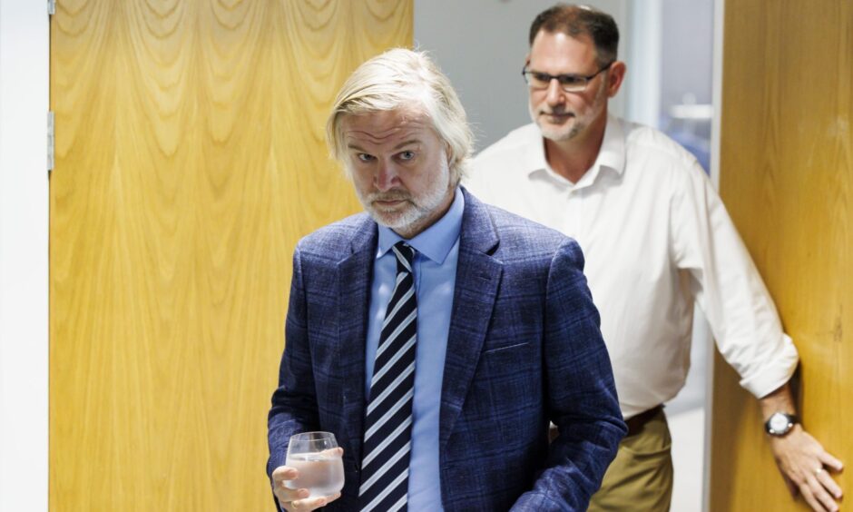 Dundee FC's Steven Pressley and John Nelms enter the room at Gardyne. Image: Mark Scates/SNS