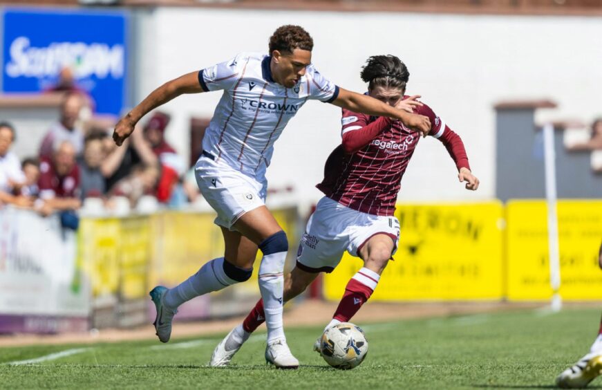 Dundee's Ethan Ingram takes the game to Arbroath. Image: Ross Parker/SNS