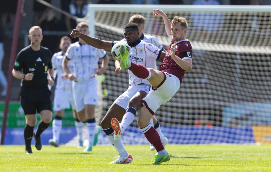 Emile Acquah battles with Arbroath's Thomas O'Brien. Image: Ross Parker/SNS