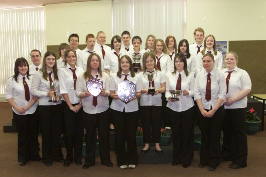 Senior prize-winners lining up with trophies in June 2004.