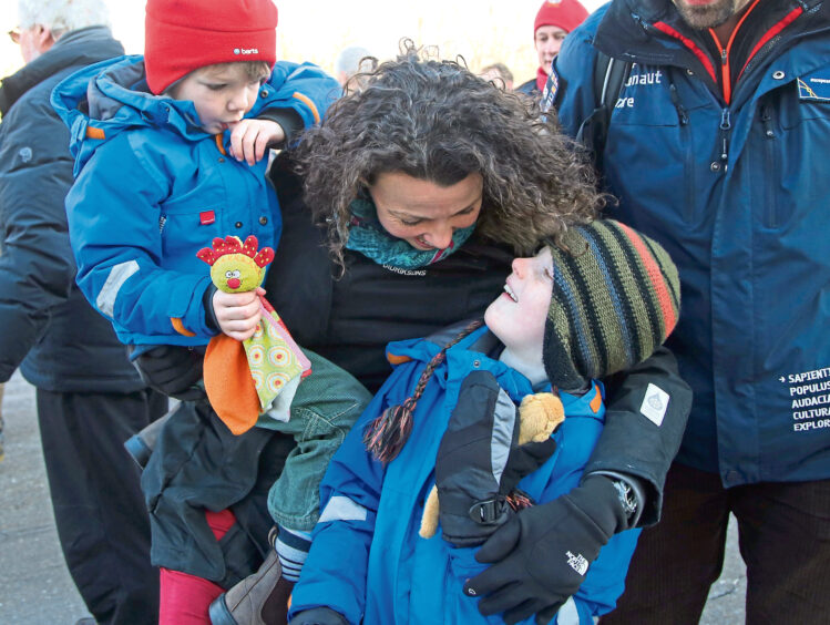 Rebecca and sons Oliver and Thomas watch Tim's launch to the ISS.