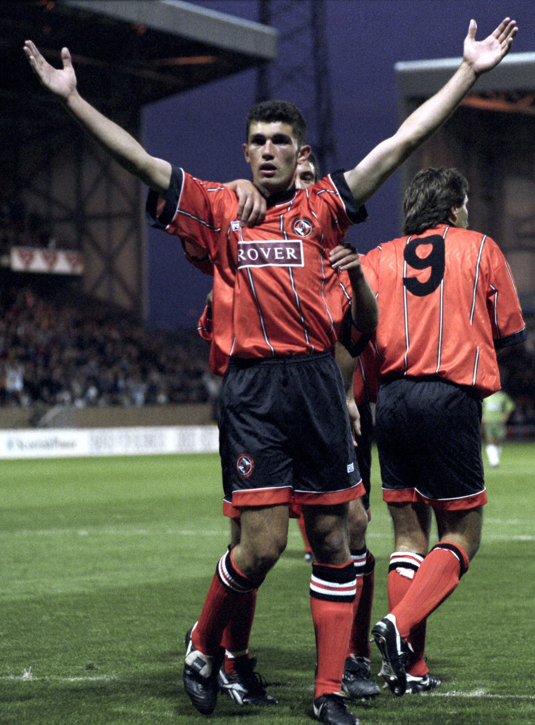Arms in the air, Gordan Petric salutes the fans after scoring for Dundee United