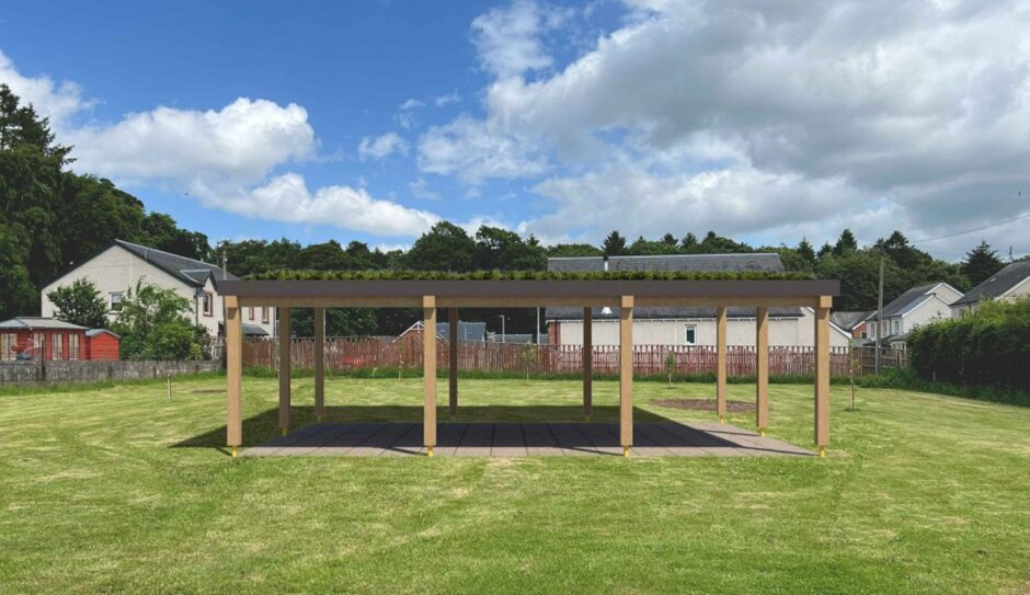 Design showing simple timber structure with grass on roof, surrounded by grassy village green