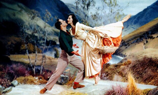 Gene Kelly and Cyd Charisse dance in a scene from Brigadoon.
