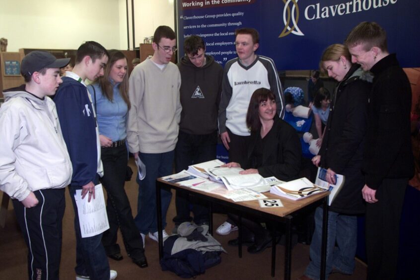 pupils gathered around a table at the careers event in 2002.