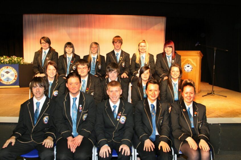 Senior prize-winners pictured on the stage at Braeview Academy.