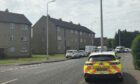 Police parked on Ballindean Road, Douglas.