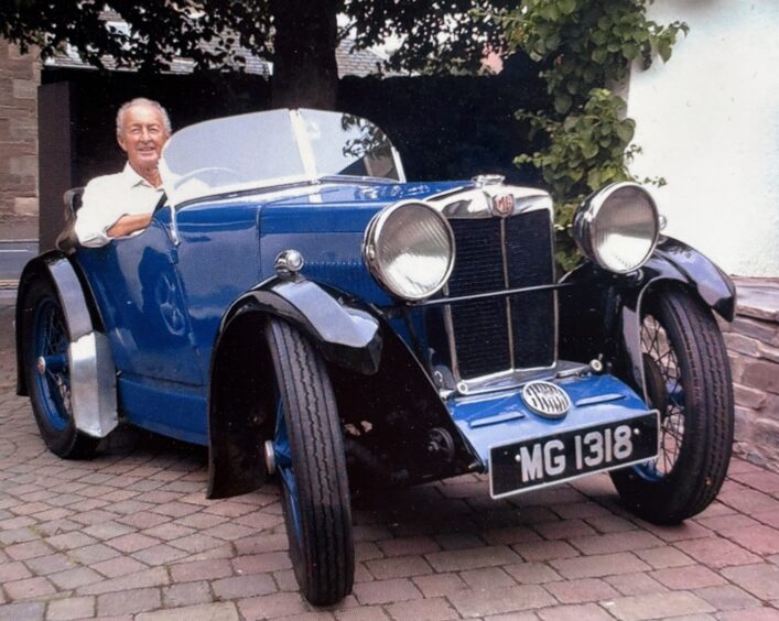 Bobby Black in a vintage car