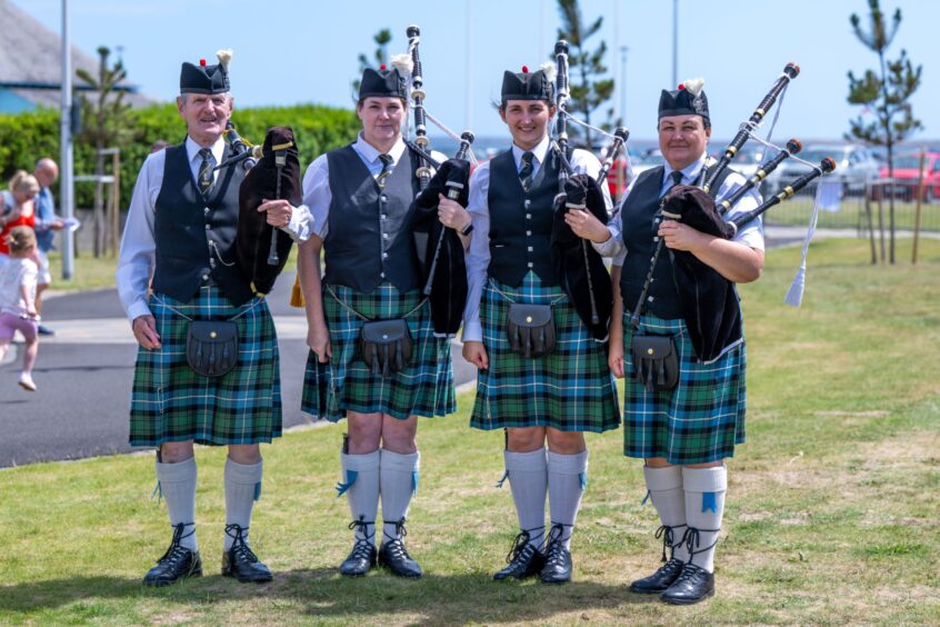 David Myles, Wendy Woolsey, Danielle Myles and Donna Myles from the Forfar and District Pipe Band.