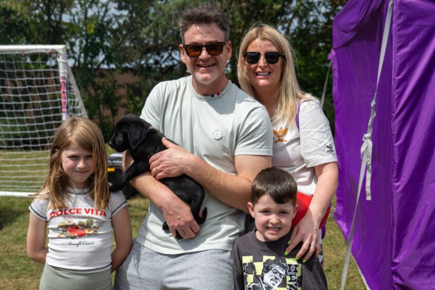 Rae, Lennie the dog, Paul, Cheryl, and Luca McCaffrey.