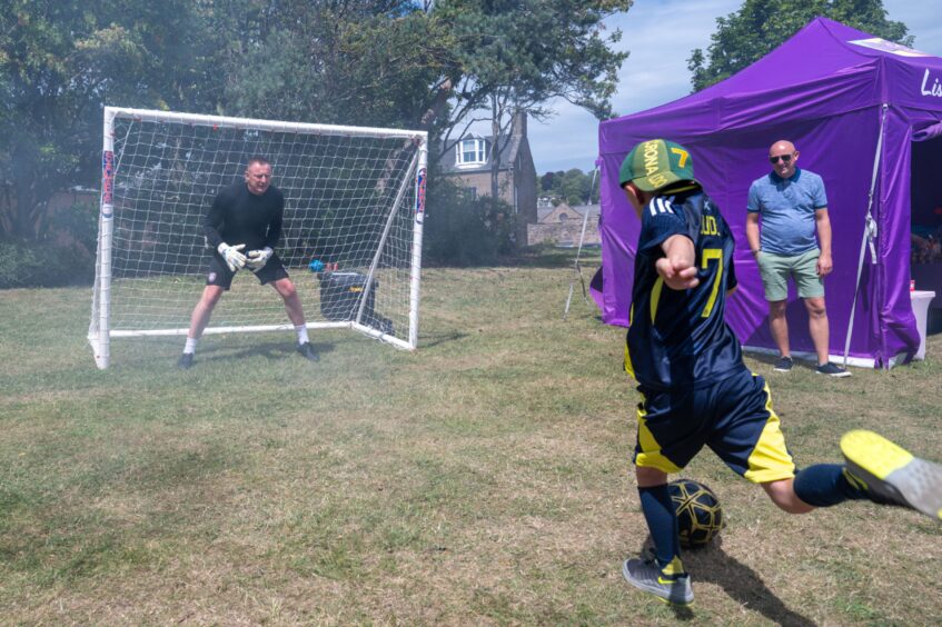 Seven-year-old Jude Taylor takes on Rab Douglas in Beat The Keeper.
