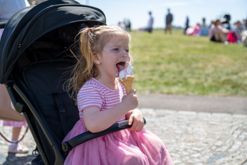 Two-and-half-year-old Orla Robertson enjoys an ice cream on the first day of Broughty Ferry Gala Week.