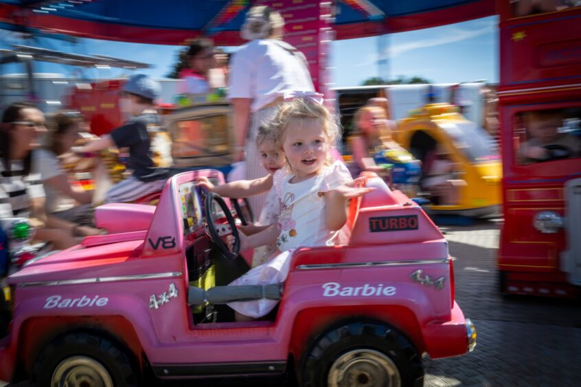 Youngsters Maya Donalds and Maeva Black on a ride.