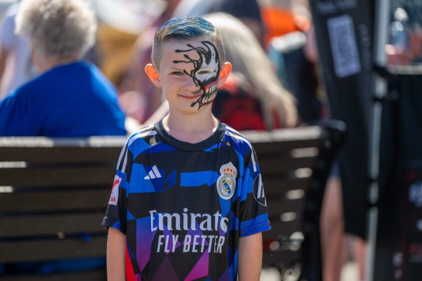 Oliver McKenzie with his face painted.