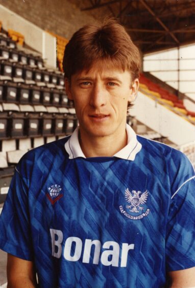 Baltacha in a St Johnstone top in the stand at McDiarmid Park.