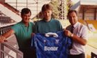 Sergei Baltacha, holding a St Johnstone shirt, with coach Bert Paton and manager Alex Totten in a McDiarmid Park stand in July 1990.