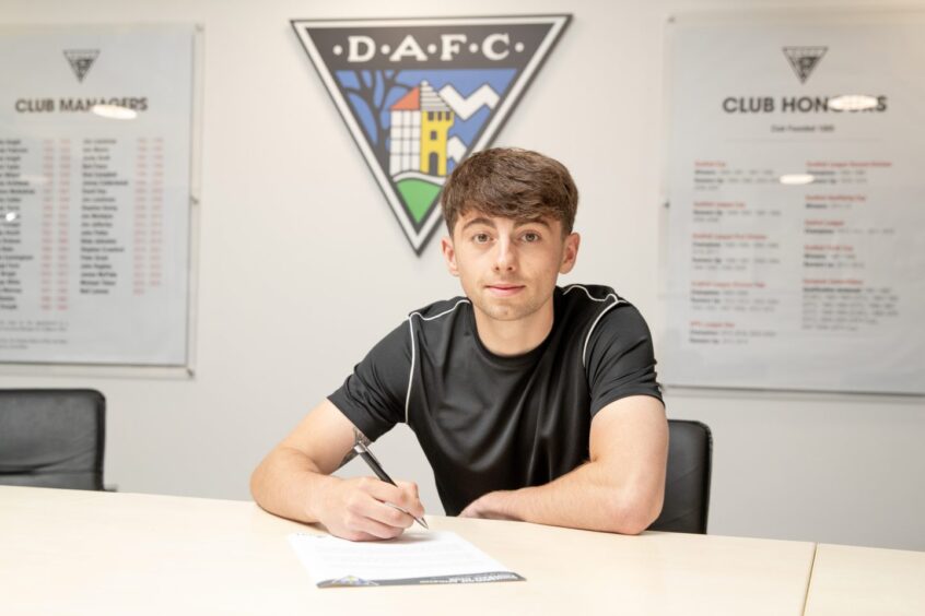 Josh Cooper puts pen to paper on his new DAFC contract