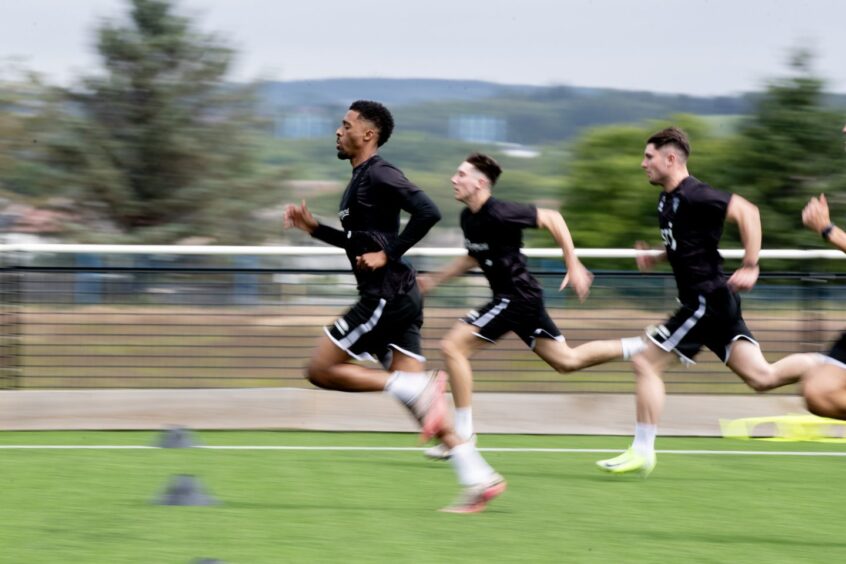 Tashan Oakley-Boothe strides out in pre-season running with the Pars.