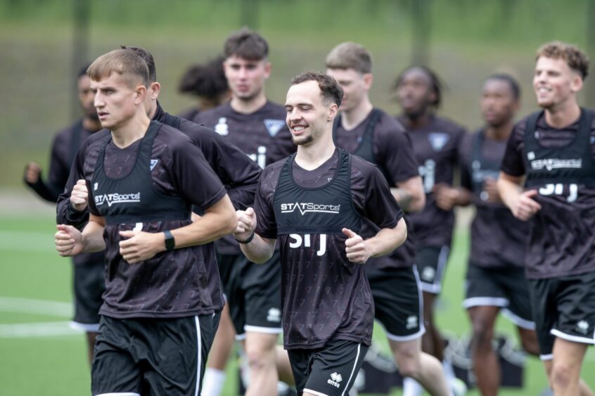Dunfermline players run during pre-season training.