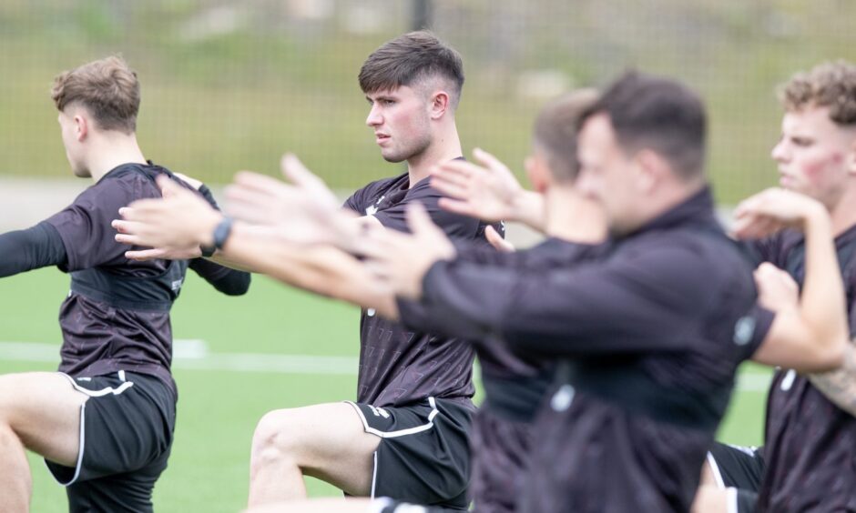 Dunfermline Athletic players exercise during pre-season training.