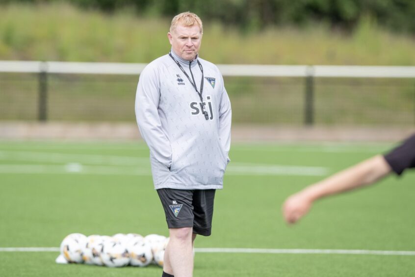 Neil Lennon stands with his hands in his pockets as he watches Dunfermline's pre-season training.