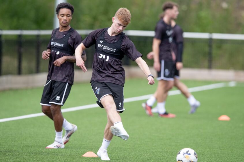 Keith Bray plays a pass in training with Dunfermline.