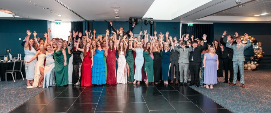Revellers line up for a group picture at Forfar Academy's 2025 final fling 