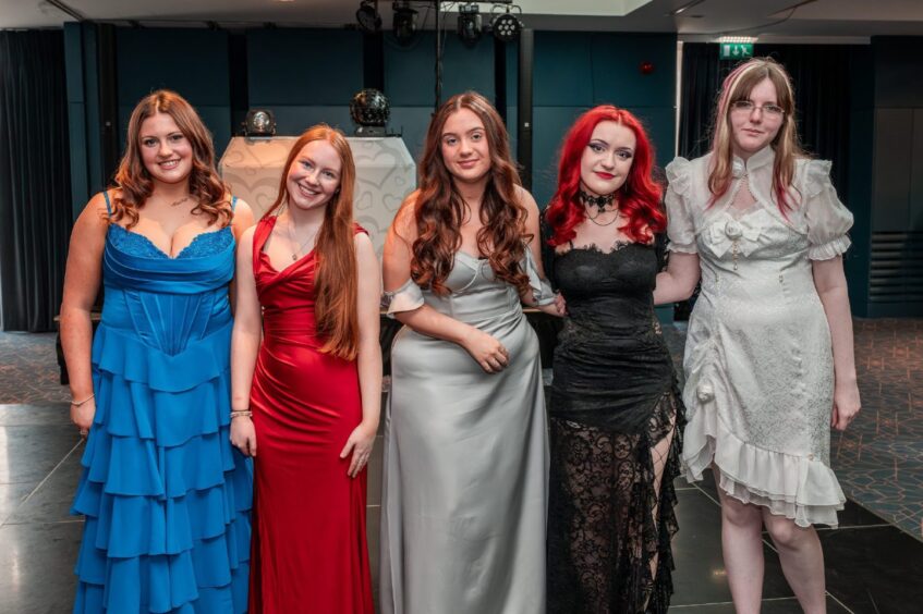 Young women in formal dresses