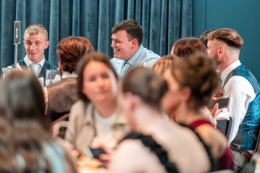 Guests chatting at a table