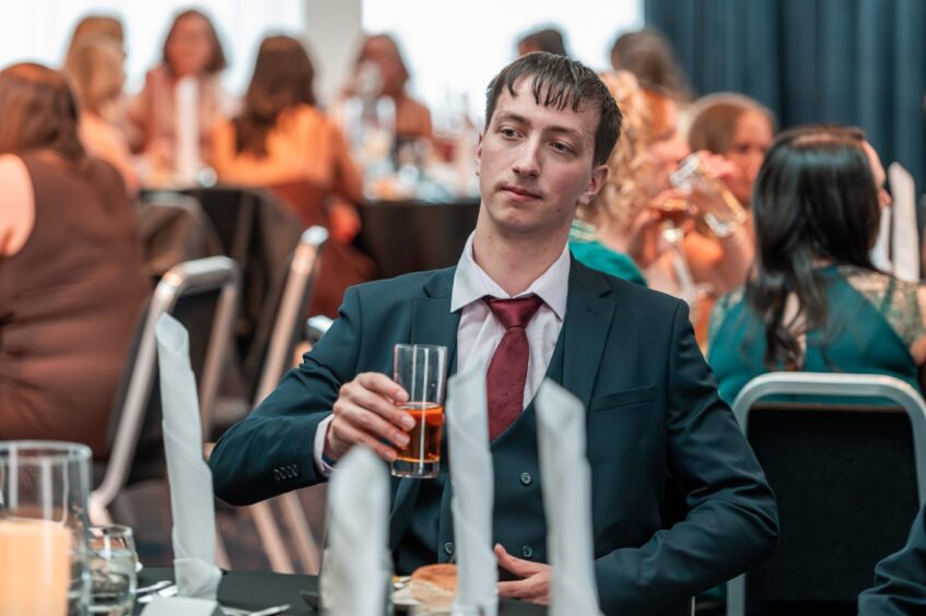 A guest sits at a table at the Apex, Dundee