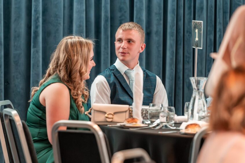 Guests wait for dinner at a table