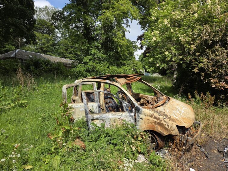 The older burnt-out car at Camperdown Park in Dundee. 