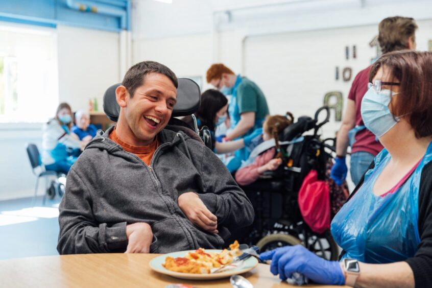 Staff and residents at Capability Scotland's Upper Springland campus