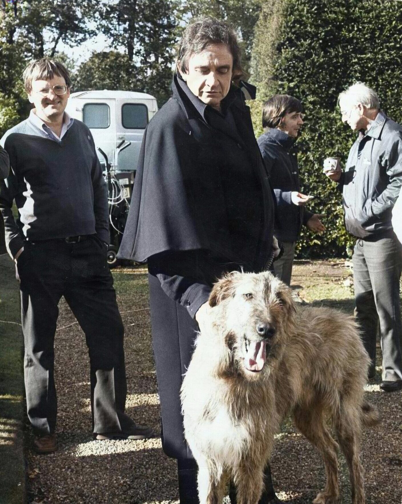 Johnny Cash with a dog during filming in Fife.