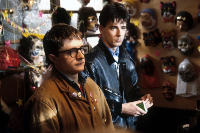 Joe Mullaney and Vincent Friell in a shop in a scene from Restless Natives.
