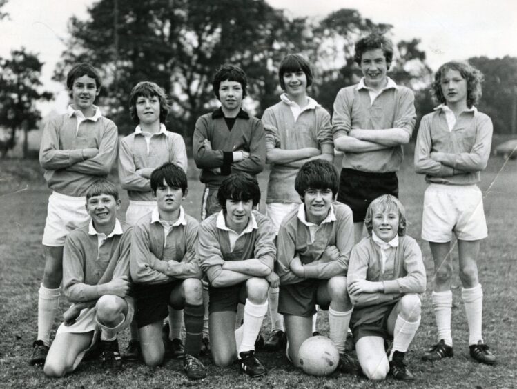 Craigie High School under-14 XI line up outside for a picture.