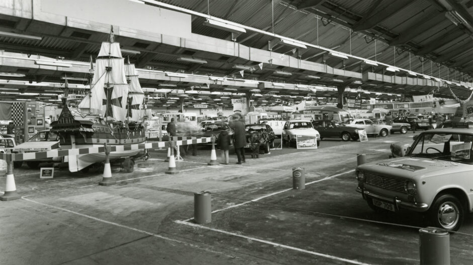 Several cars and a boat on display in 1978.