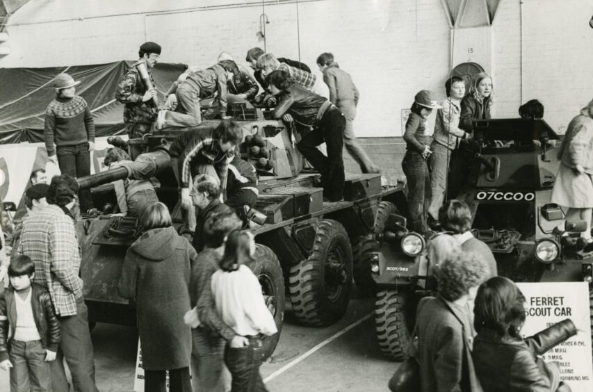 Children take a look at some of the Army's vehicles in 1979. 