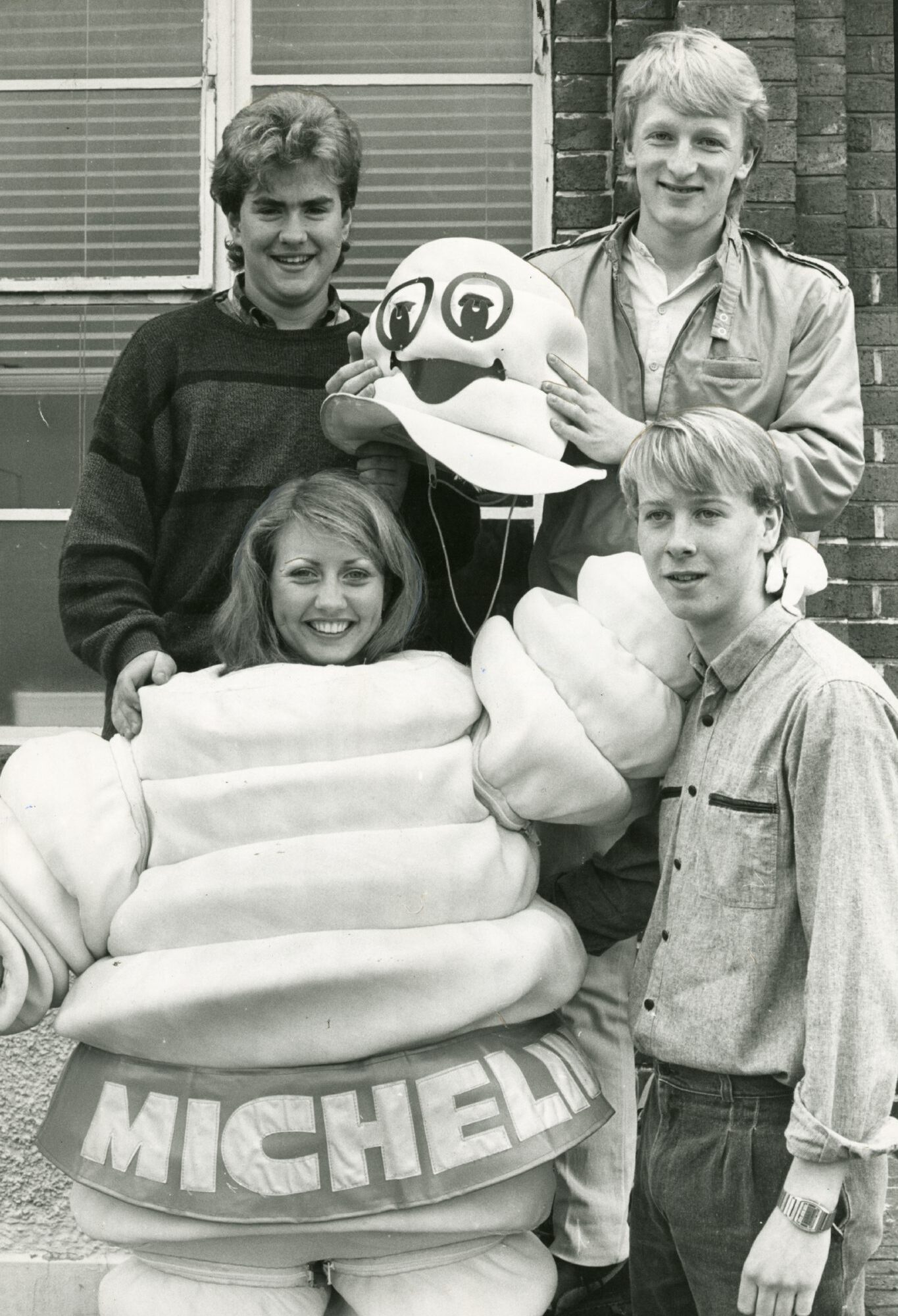 Sharon Ellis is helped into a puffy Michelin man outfit by apprentices Paul Nelson, Alistair Carrie and Stewart Paterson in May 1985.