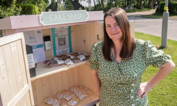 Debbie Farquharson standing by her open cake shed.