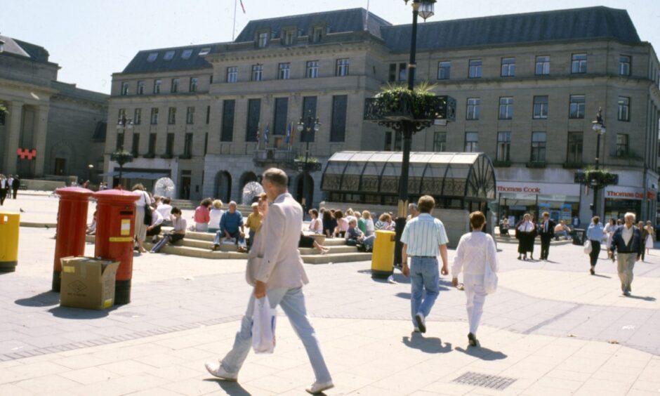 picture shows pedestrians walking past two red post boxes on a sunny day in Dundee City Square in June 1988.