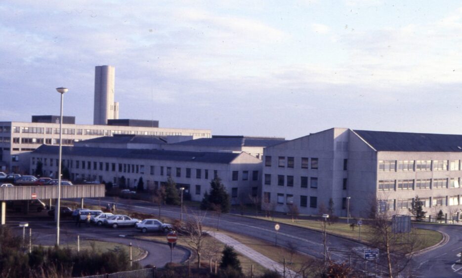 an elevated shot showing a car park, roads and buildings at Dundee's Ninewells Hospital