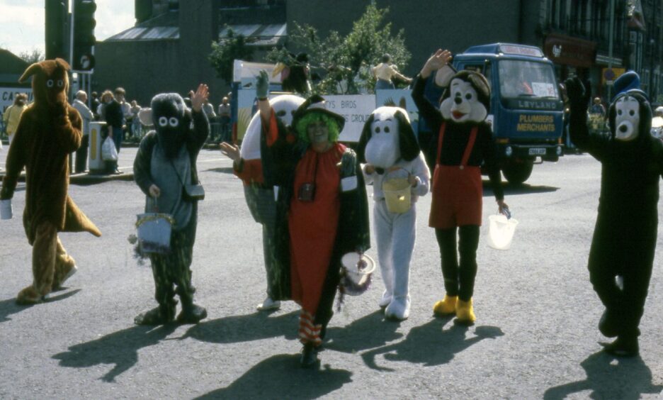 People in fancy dress walking at the Dundee Festival.